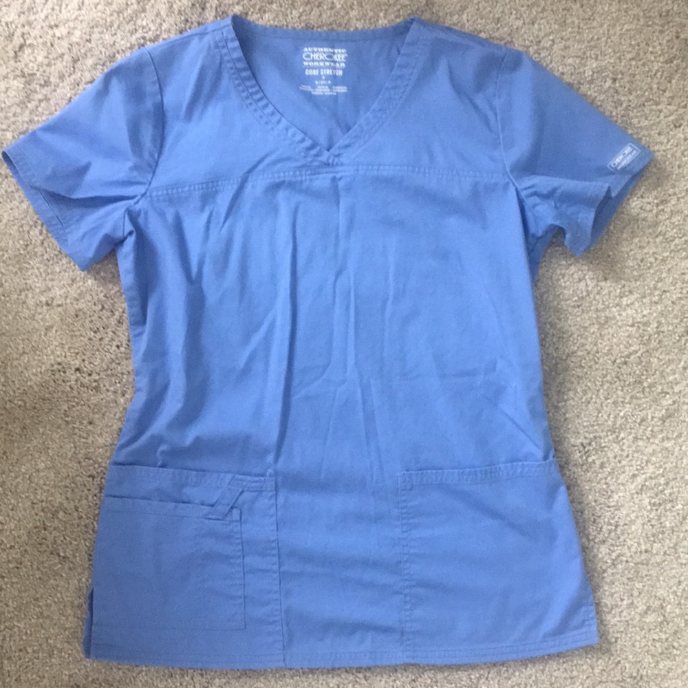 Seal blue scrub top. Good condition.